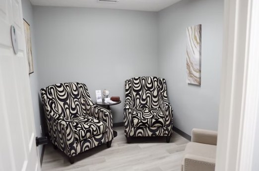 A quiet meeting room at the Hope Center with two armchairs